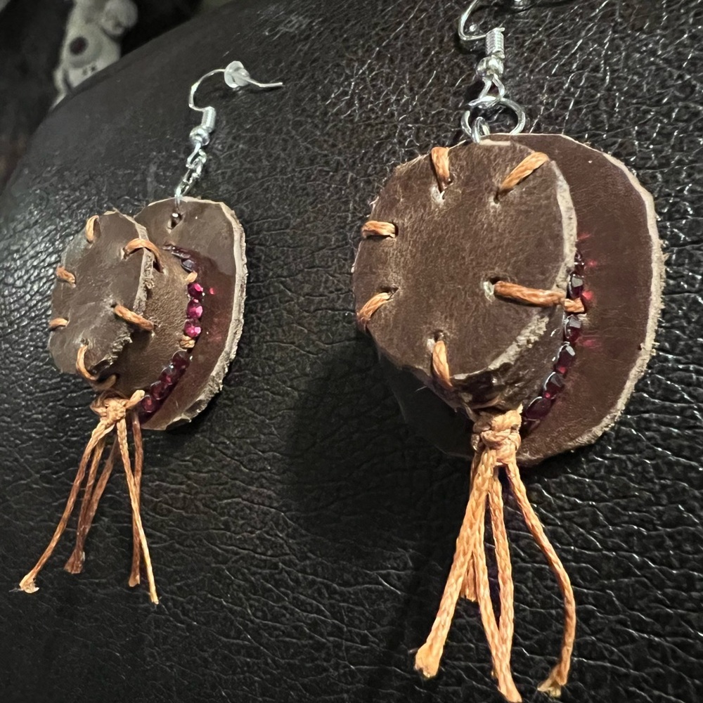 Handmade leather hat, earrings with red rhinestones.